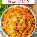 bowl full of slow cooker baked ziti topped with grated parmesan cheese.