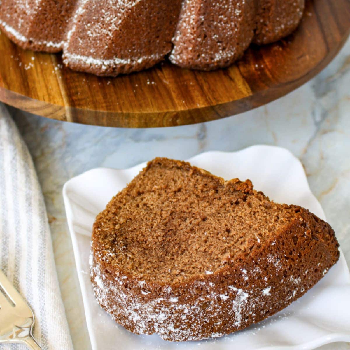 slice of buttermilk chocolate bundt cake on a plate.