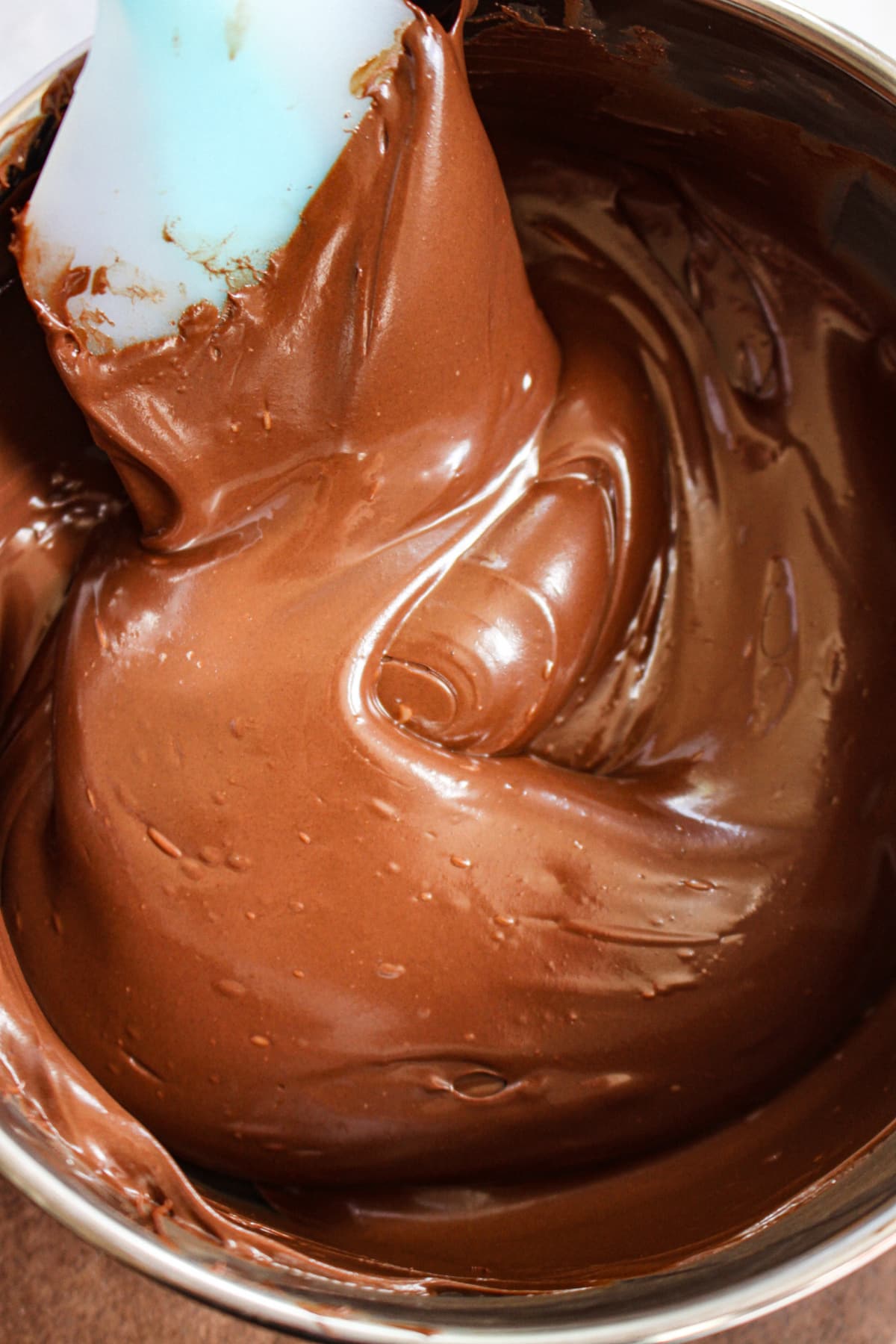 chocolate chips being melted in a saucepan.