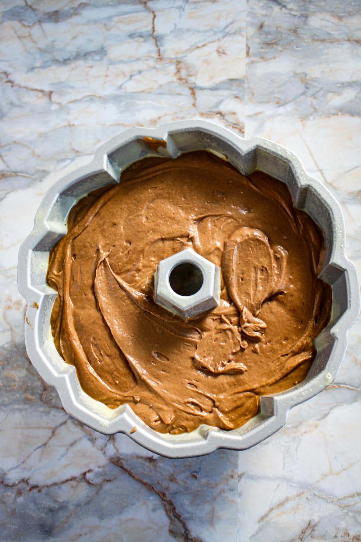 raw cake batter in a bundt cake ready for the oven.