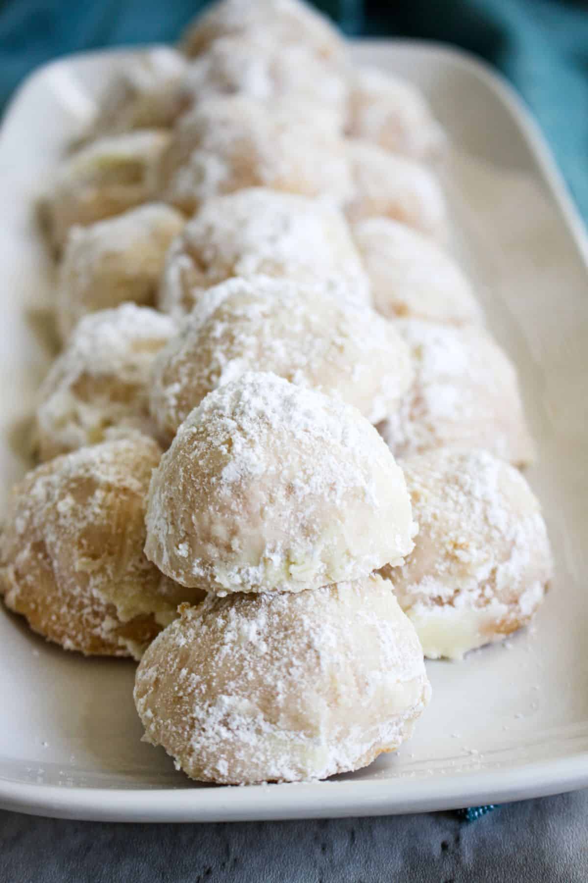Cherry snowball cookies on a serving platter.