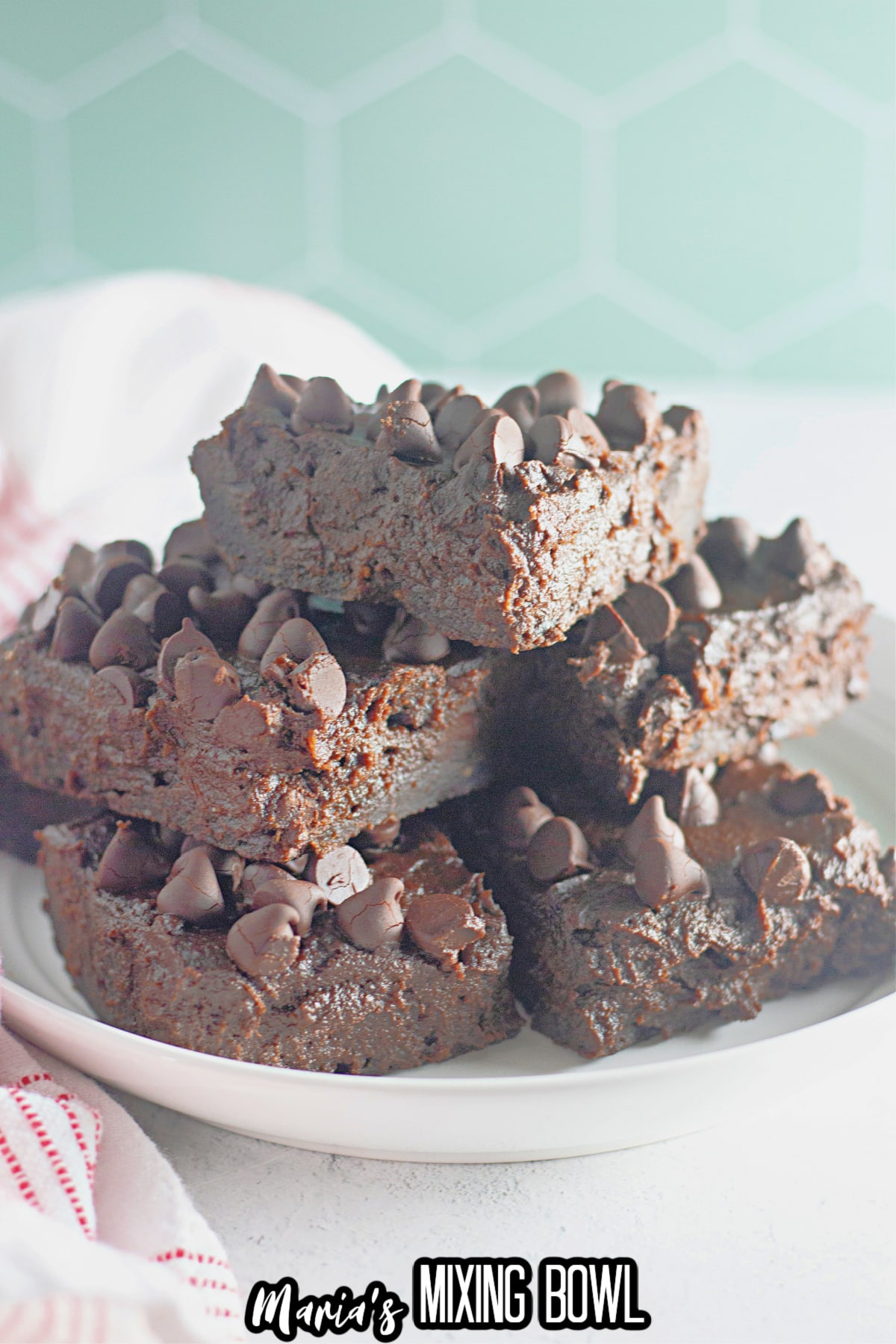 stack of chocolate pumpkin brownies on a plate.