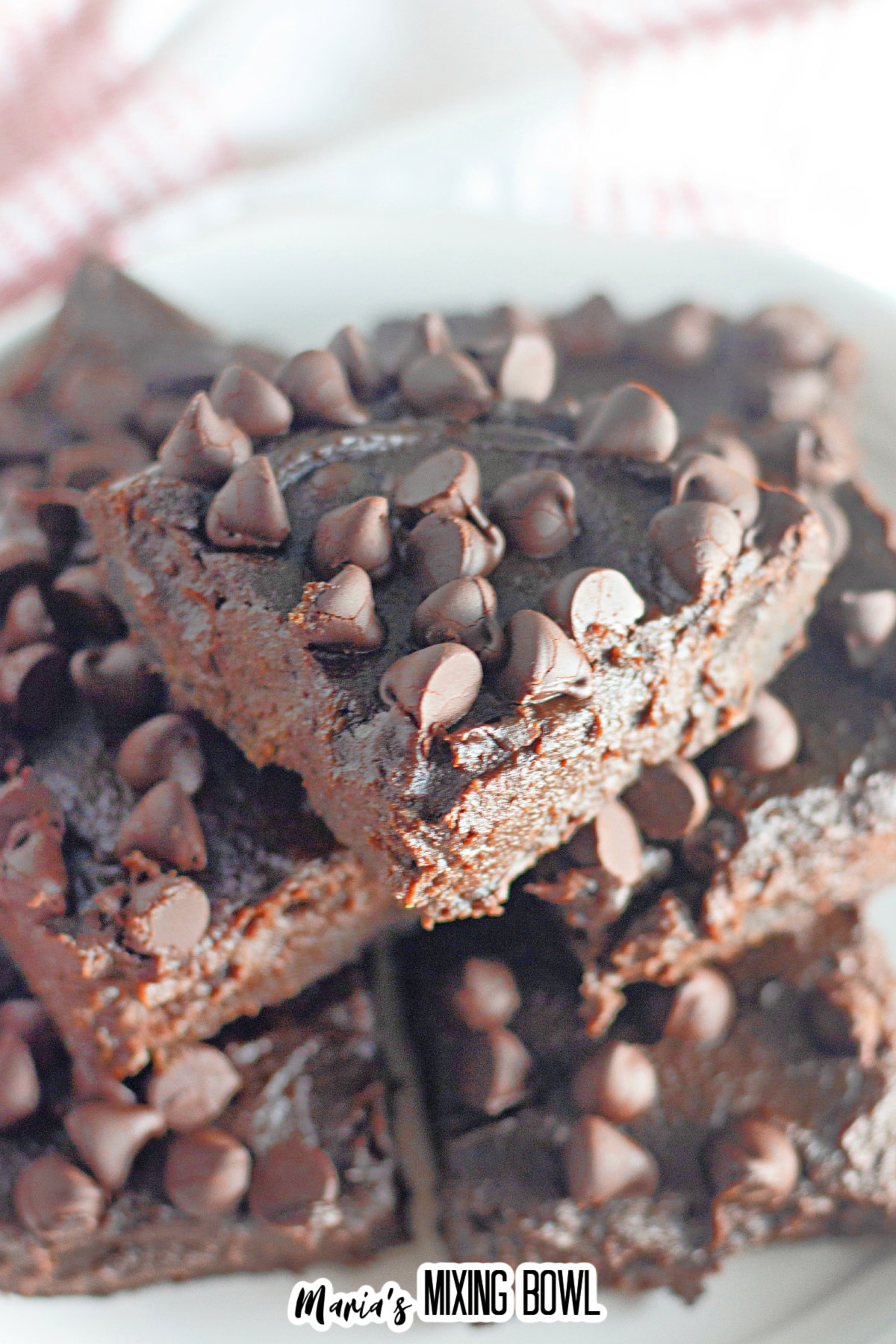 stack of chocolate pumpkin brownies on a plate.