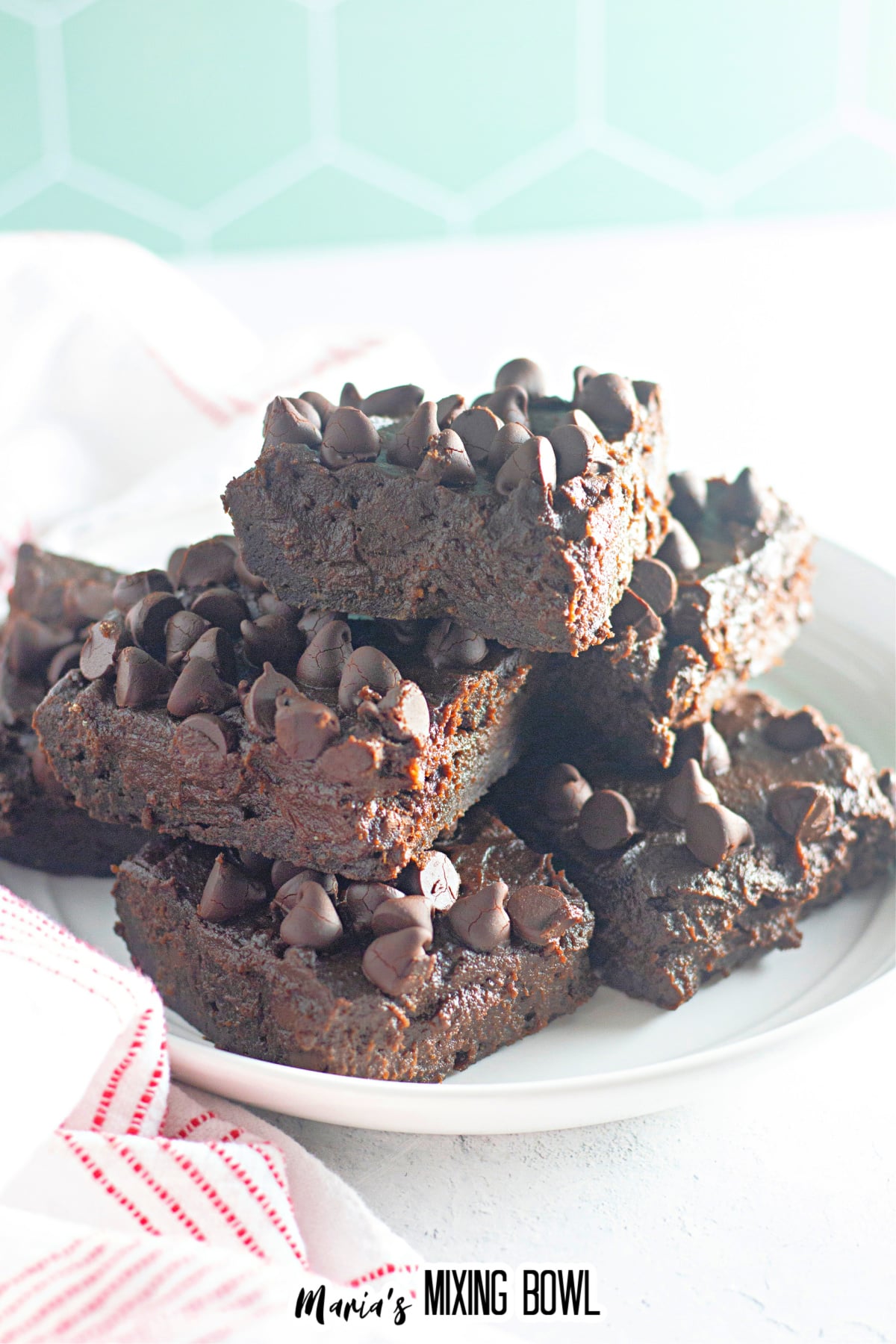 stack of chocolate pumpkin brownies on a plate.