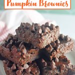 stack of chocolate pumpkin brownies on a plate.