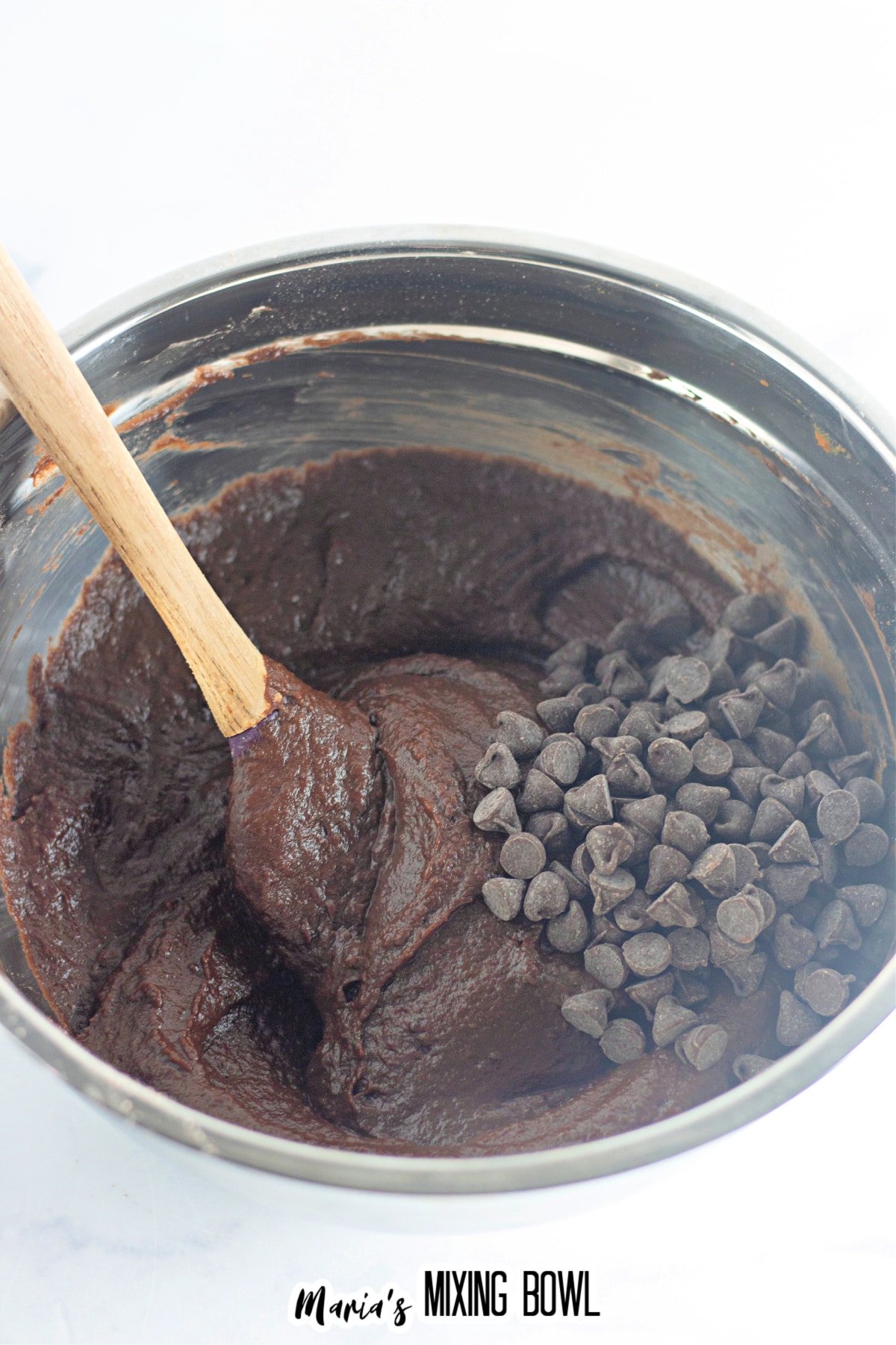 chocolate pumpkin brownies in a metal mixing bowl.