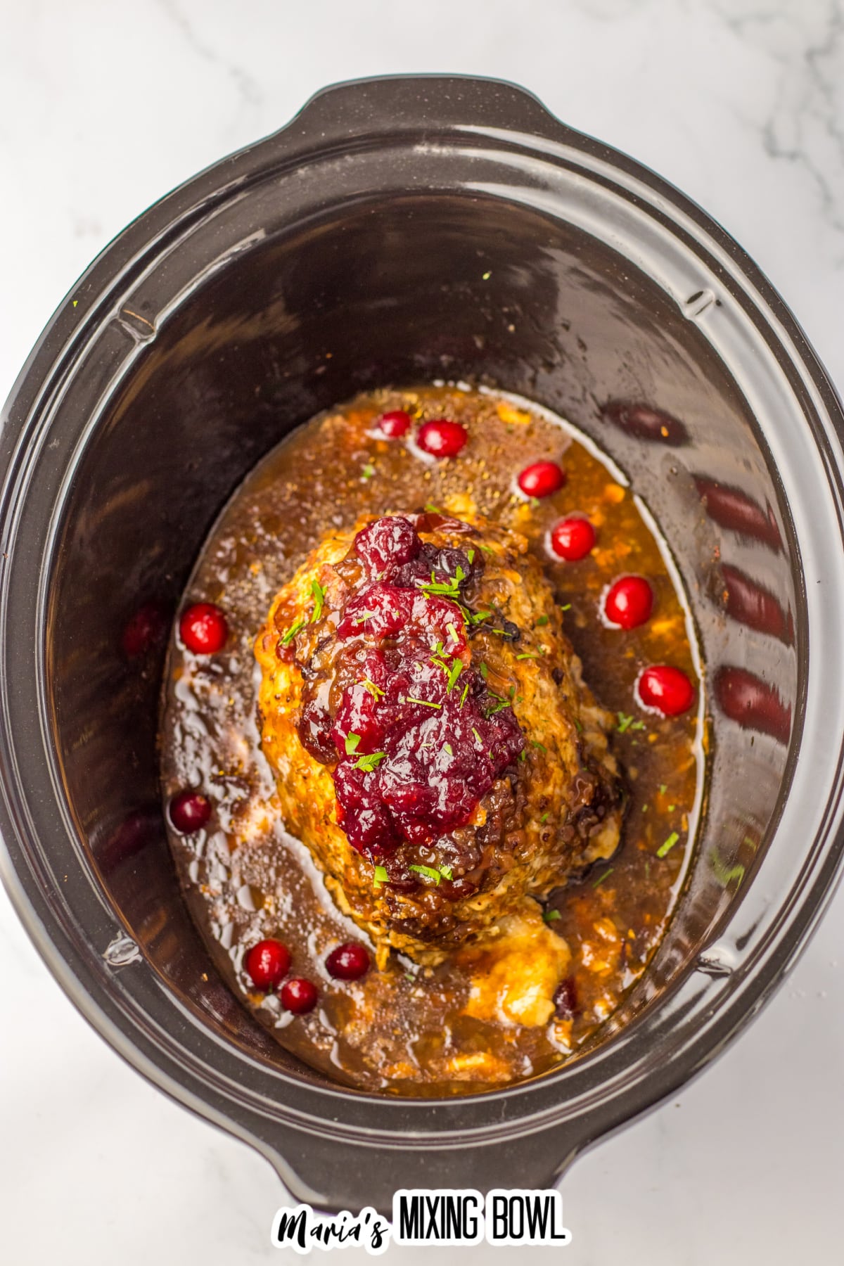 uncut cranberry turkey roast in the slow cooker.