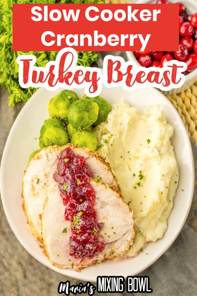 slices of cranberry turkey roast, mashed potatoes and steamed brussels sprouts on a plate.