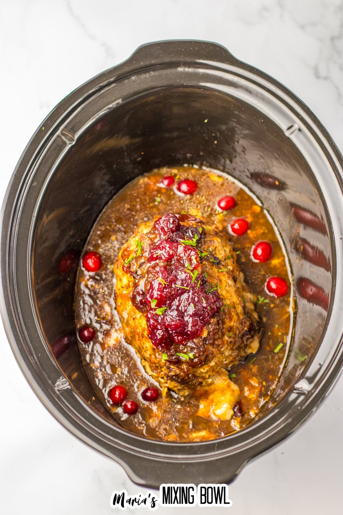 uncut cranberry turkey roast in the slow cooker.