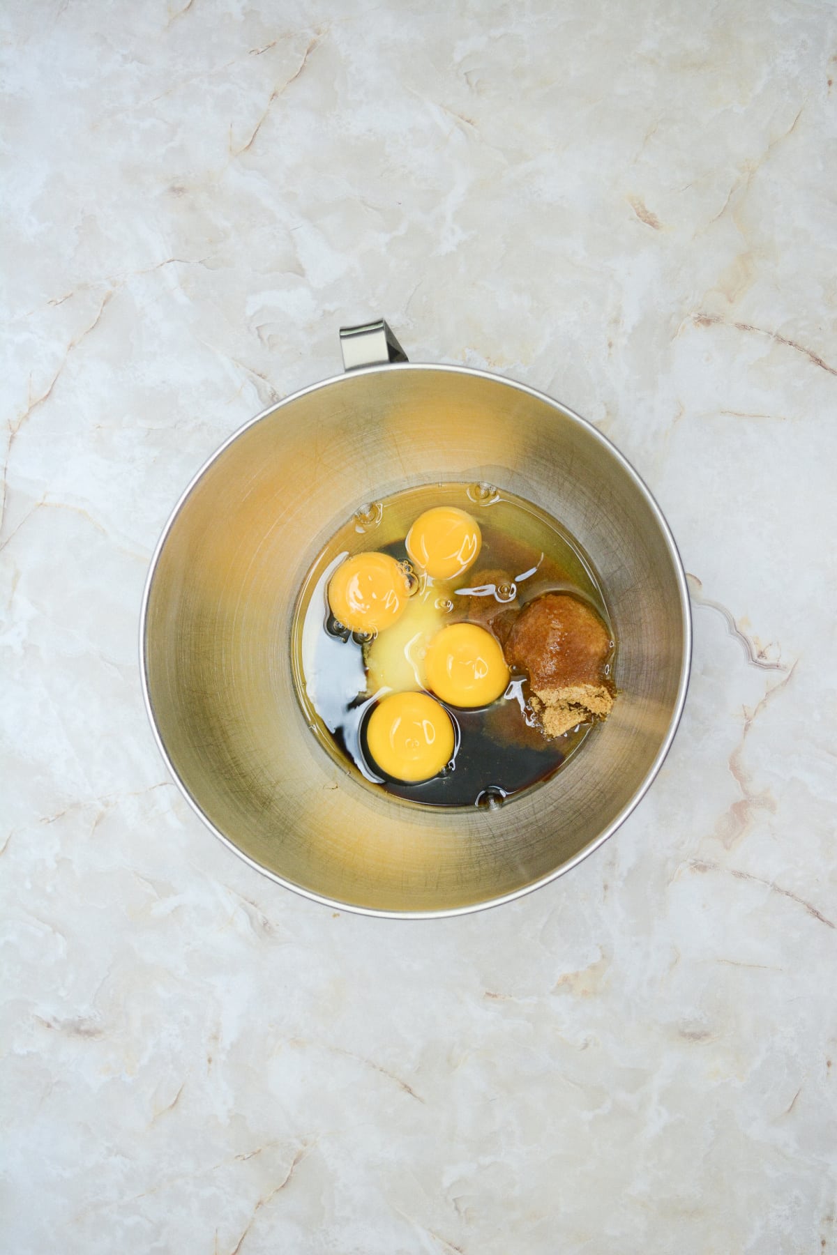 eggs, sugar, and molasses in a large mixing bowl.