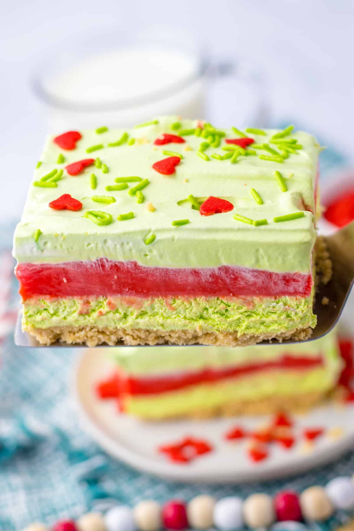 slice of grinch lush on a metal spatula.