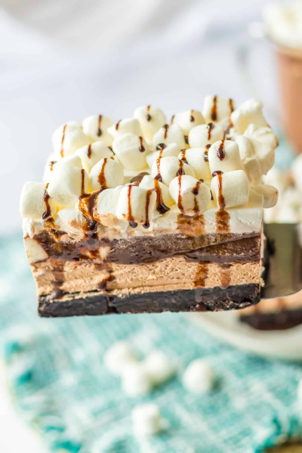 slice of hot chocolate lush on a spatula held in the air.