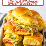 stacks of italian sub sliders on a metal serving tray.