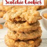 stack of four oatmeal scotchies cookies on a plate the top one has a bite missing.