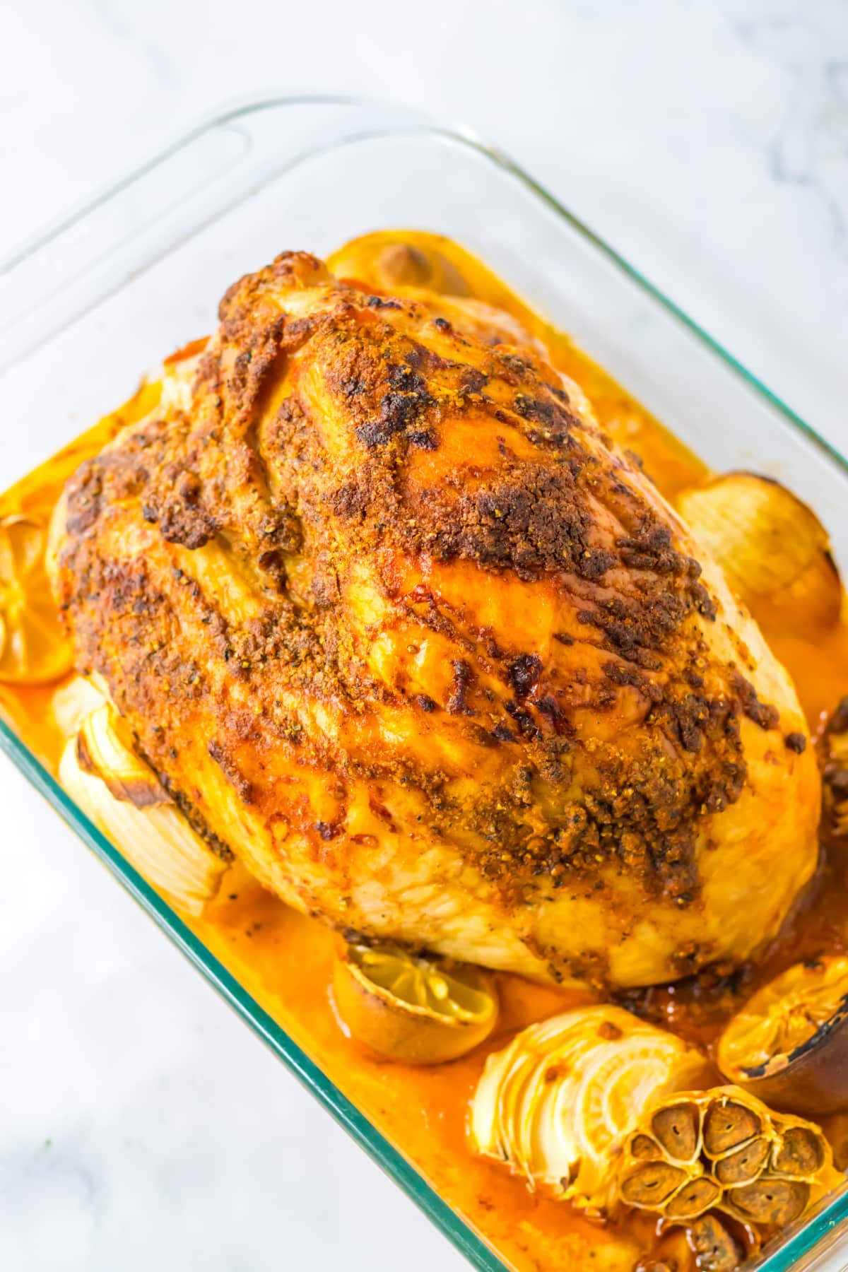 turkey breast that has been roasted in a glass baking dish.