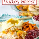 plate full of sliced turkey breast, mashed potatoes with gravy, carrots, and cranberry sauce.
