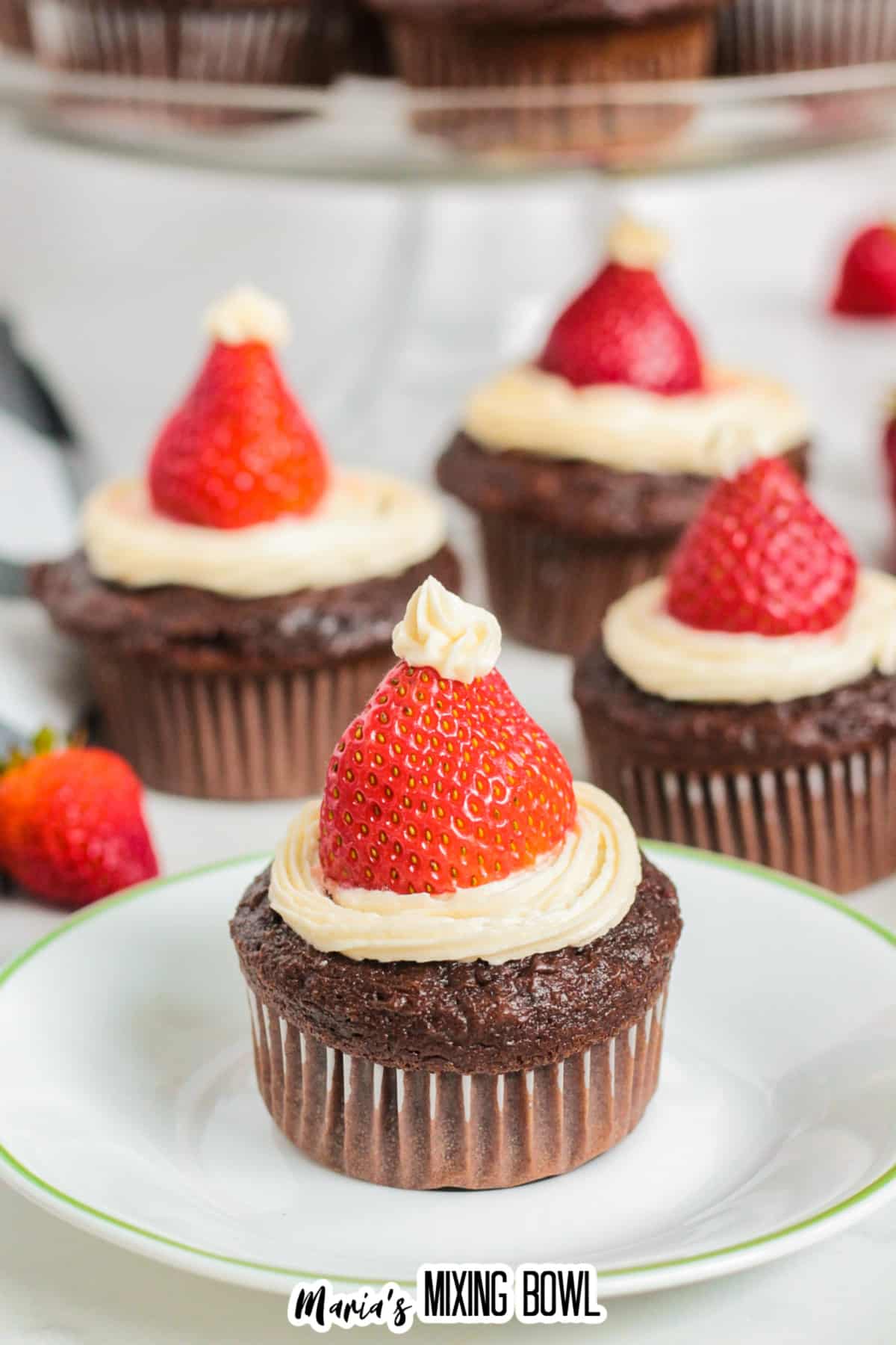 santa hat cupcake on a plate.