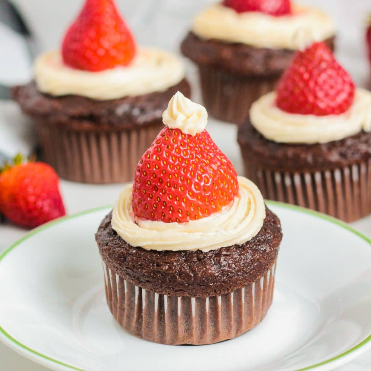 santa hat cupcake on a plate.