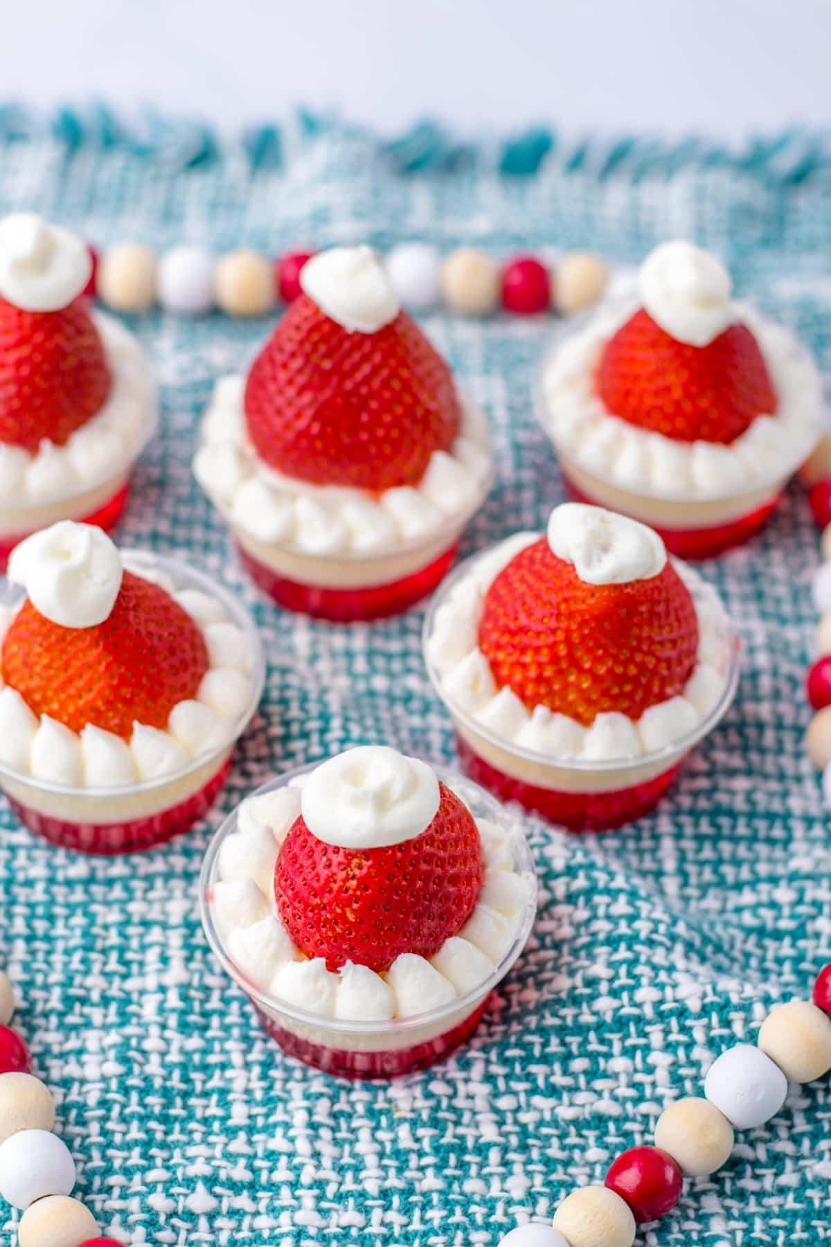 santa hat shots on a blue and white kitchen towel.