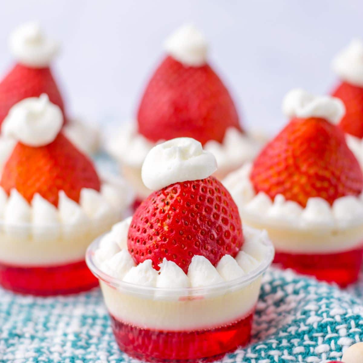 santa hat shots on a blue and white kitchen towel.