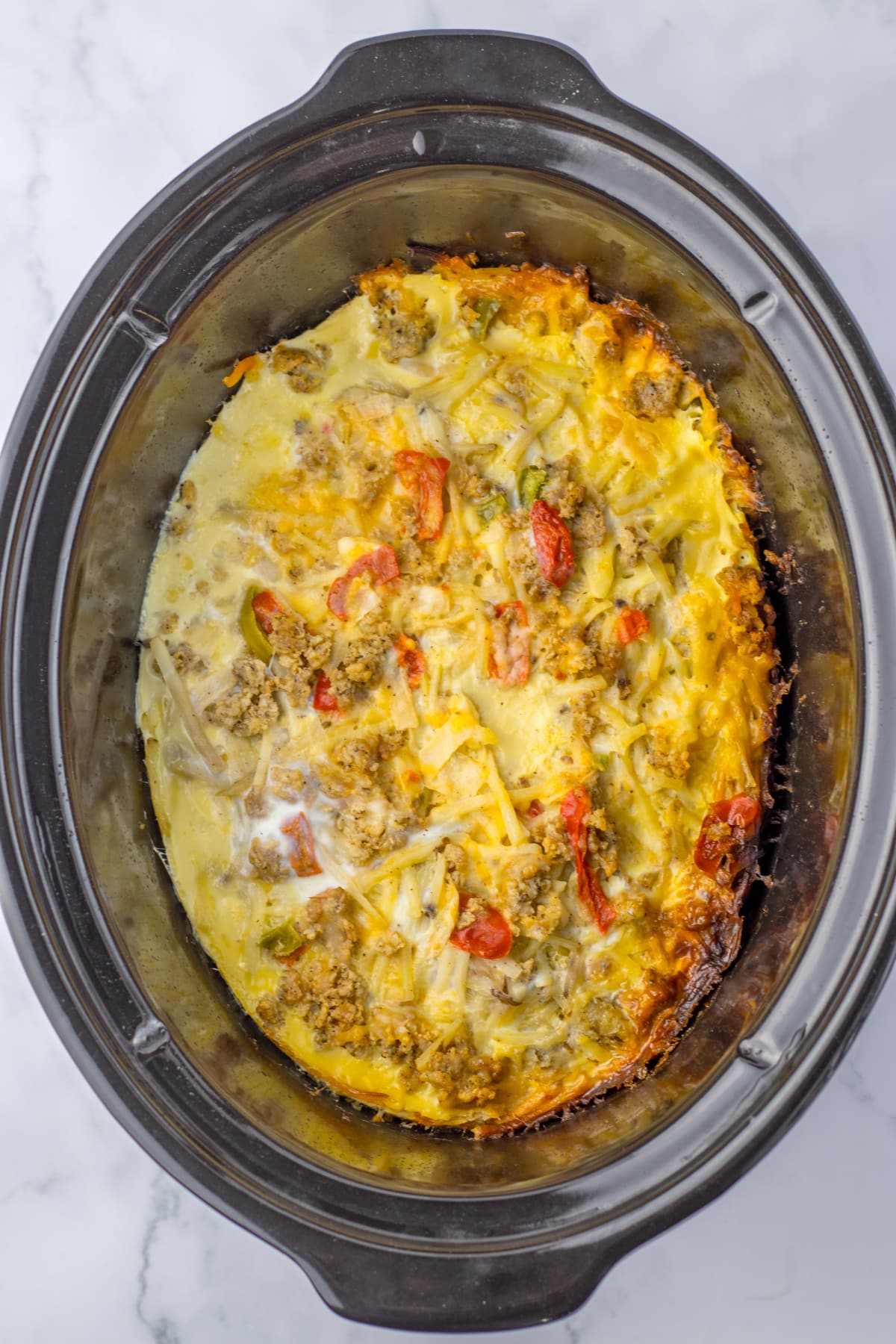 slow cooker full of cooked breakfast casserole.