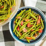 bowl of spicy green beans with pecans.