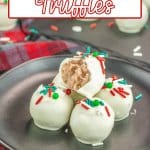 five sugar cookie truffles stacked with a bite missing from the top one.