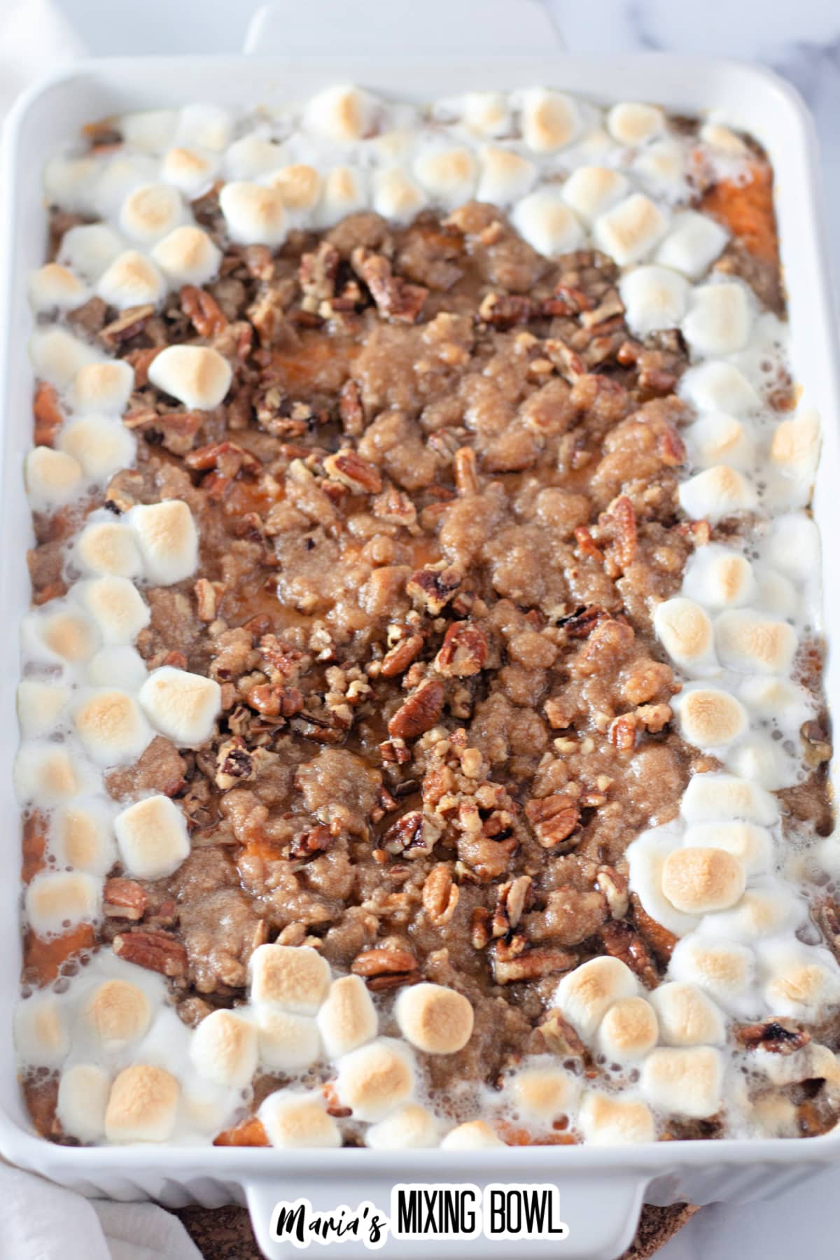 baked sweet potato casserole with pecan streusel topping and melted marshmallows.