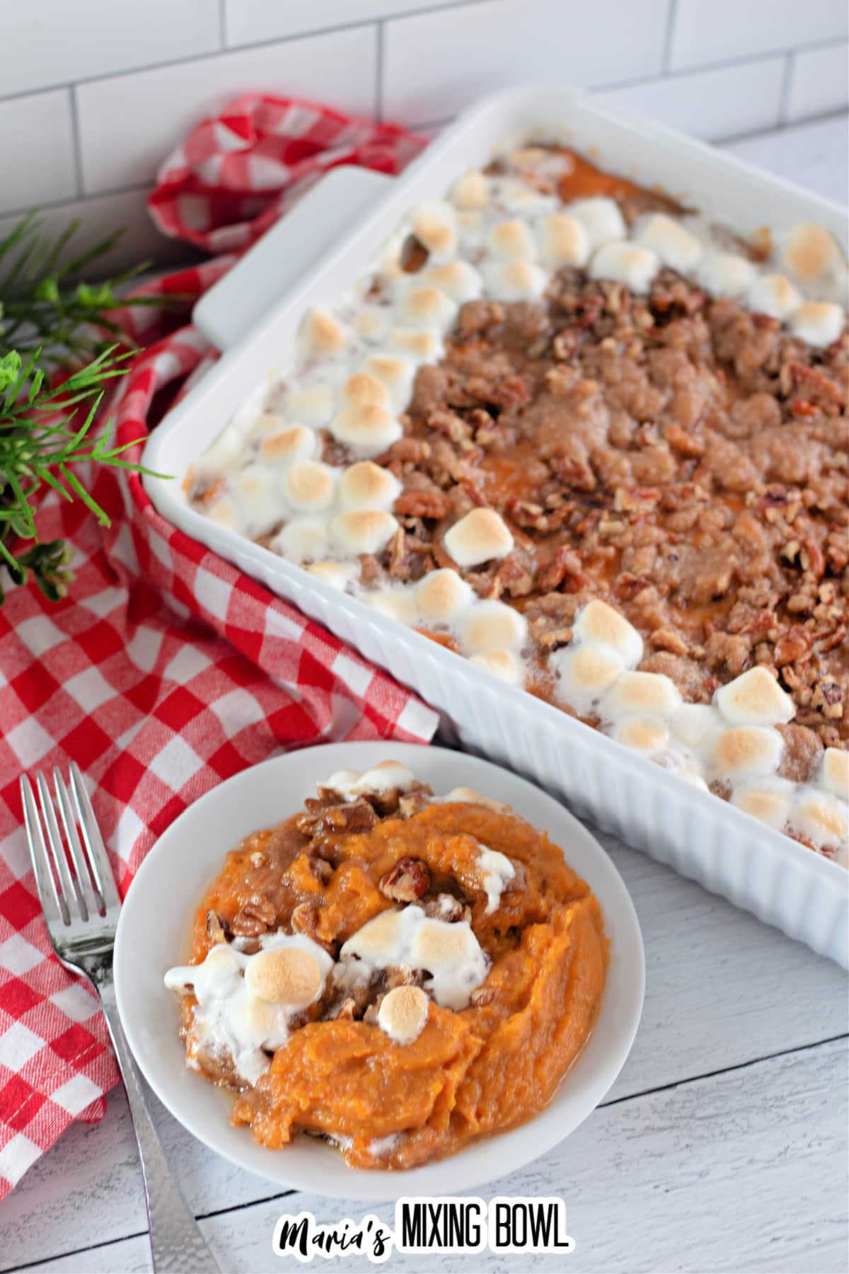 plate of sweet potato casserole with pecan streusel topping.