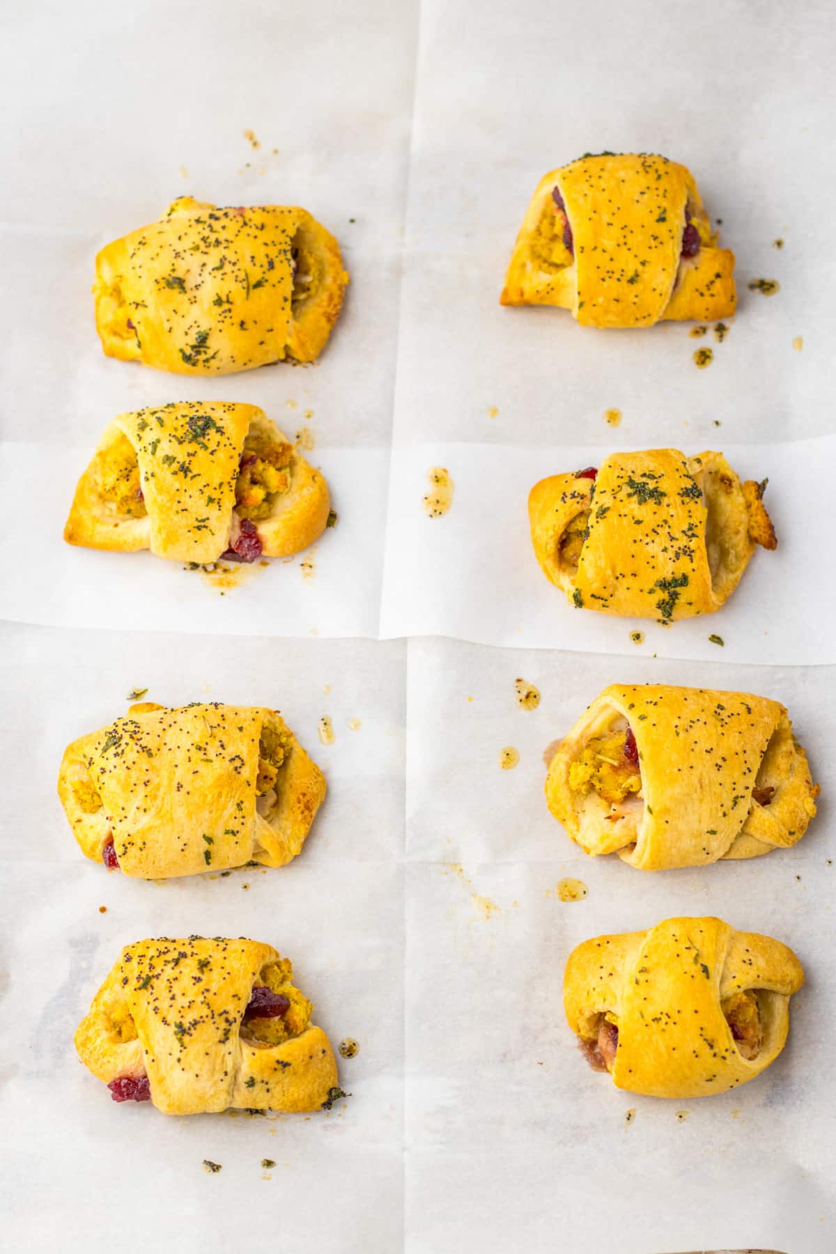 baked thanksgiving leftover crescent rolls on a parchment lined baking sheet.