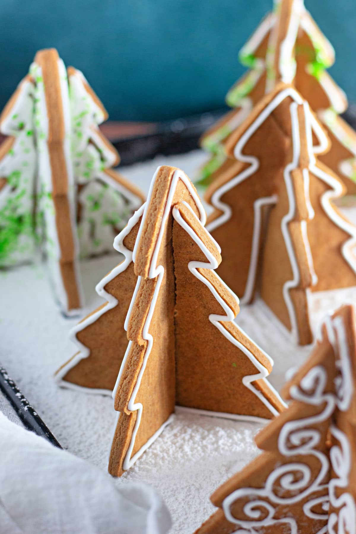 3d gingerbread trees on a baking sheet.