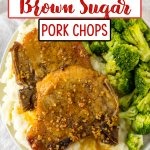 two slow cooker brown sugar pork chops on a plate with mashed potatoes and broccoli.