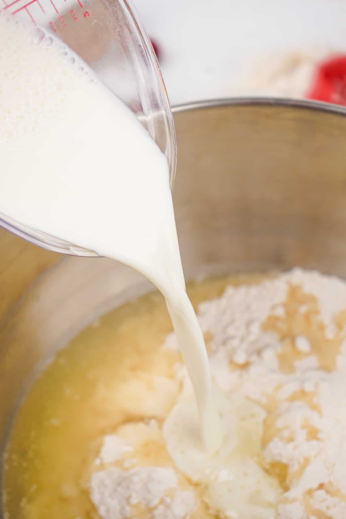cake mix being mixed in a metal mixing bowl.