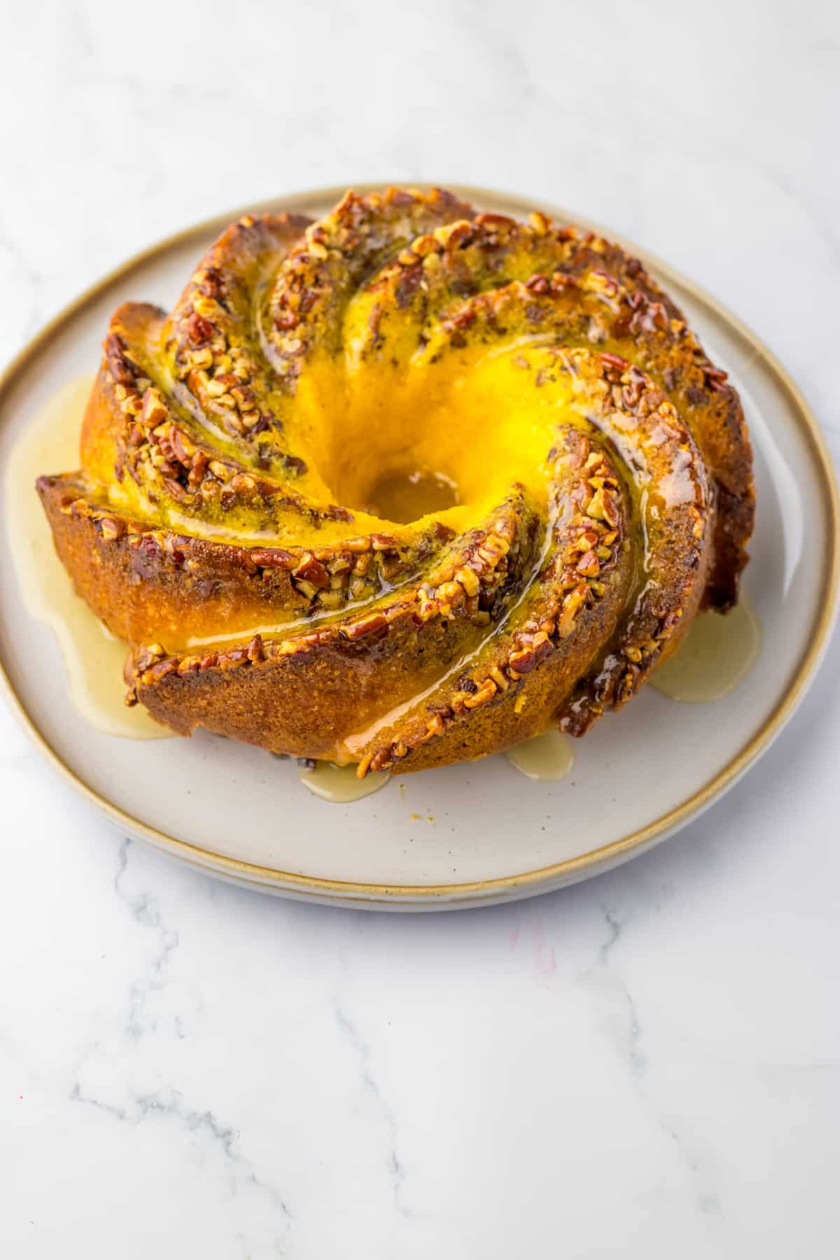 finished rum cake on a plate.
