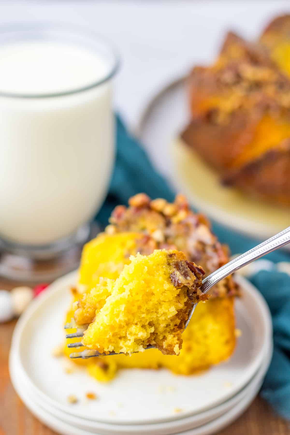 bite of easy rum cake on a fork held in the air.