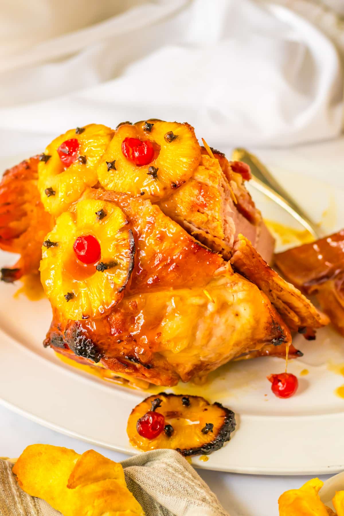honey glazed ham on a platter.