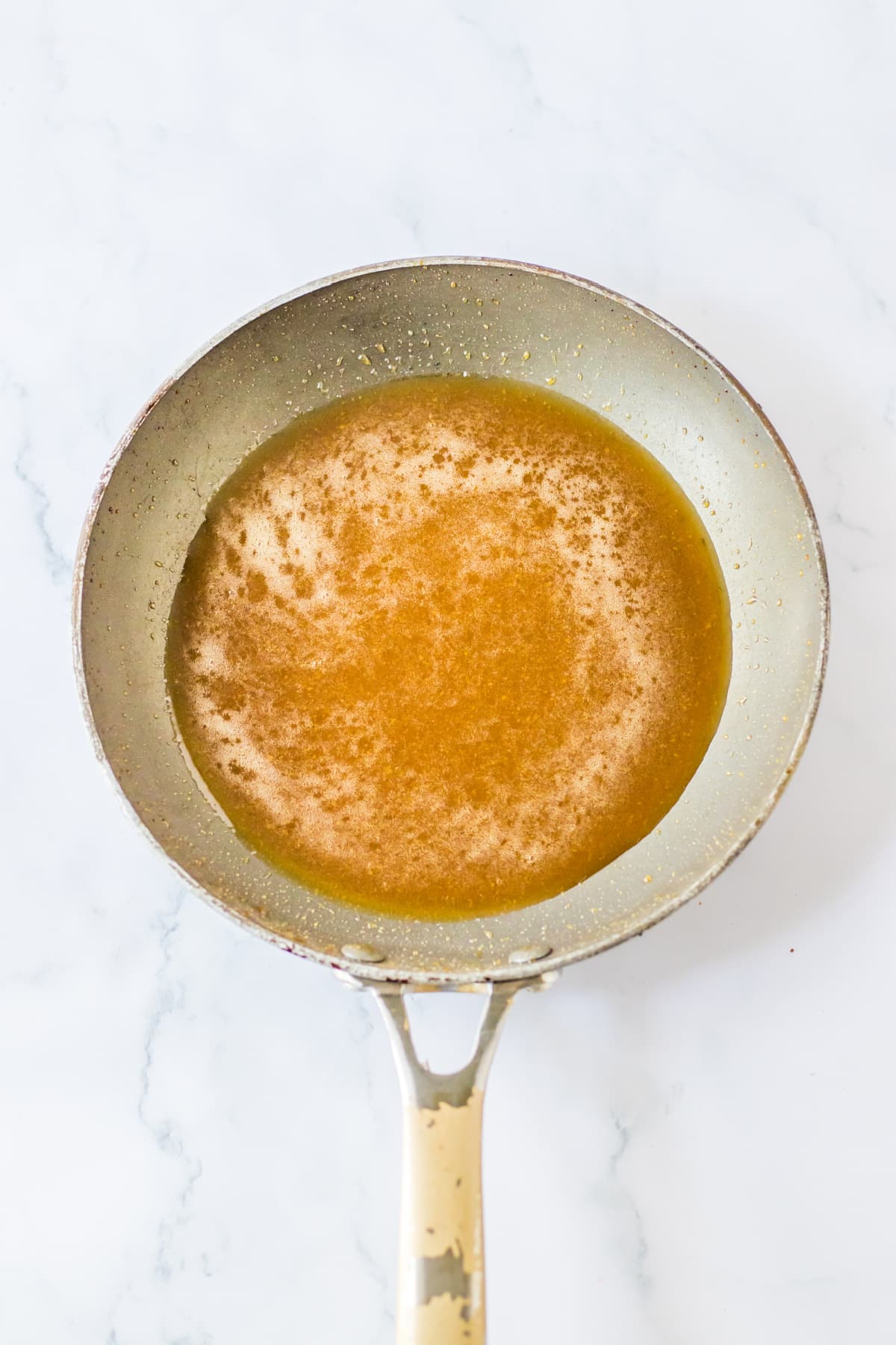 glaze being thickened in a saucepan.