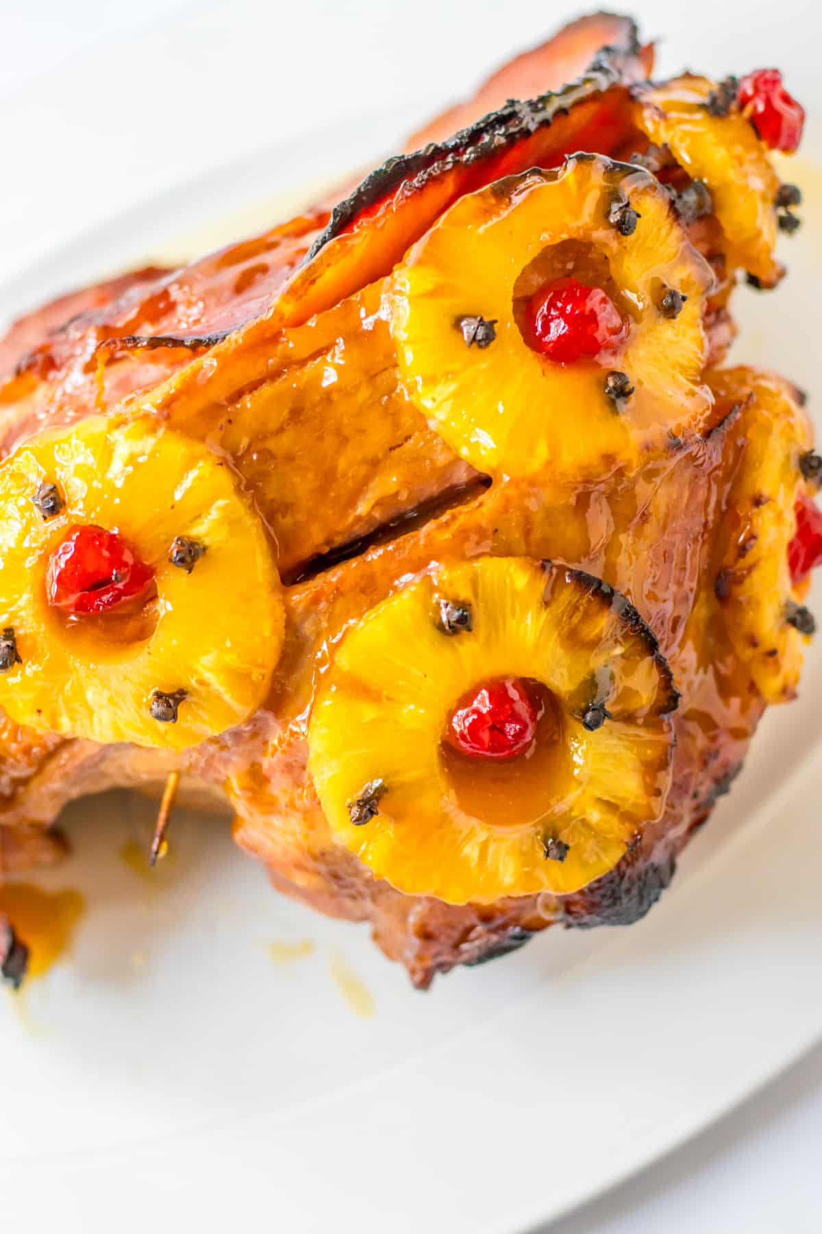 finished honey glazed ham on a platter.