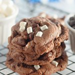 stack of three hot cocoa cookies with mini marshmallows.