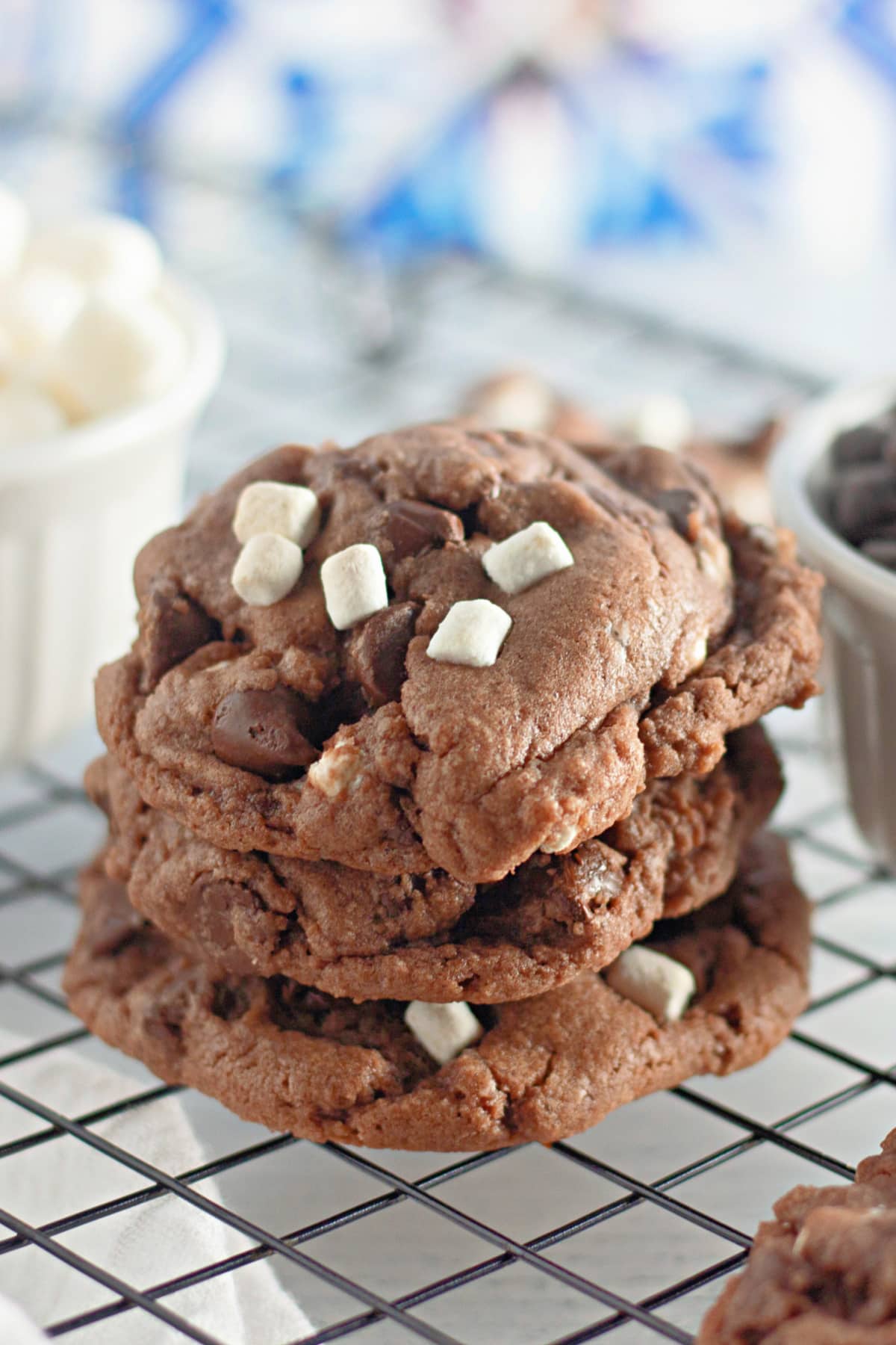 stack of three hot cocoa cookies with mini marshmallows.