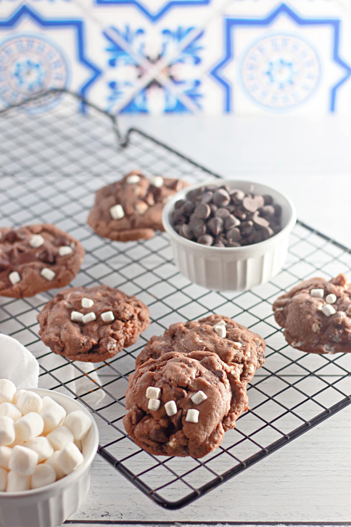 hot cocoa cookies on a wire cooling rack.
