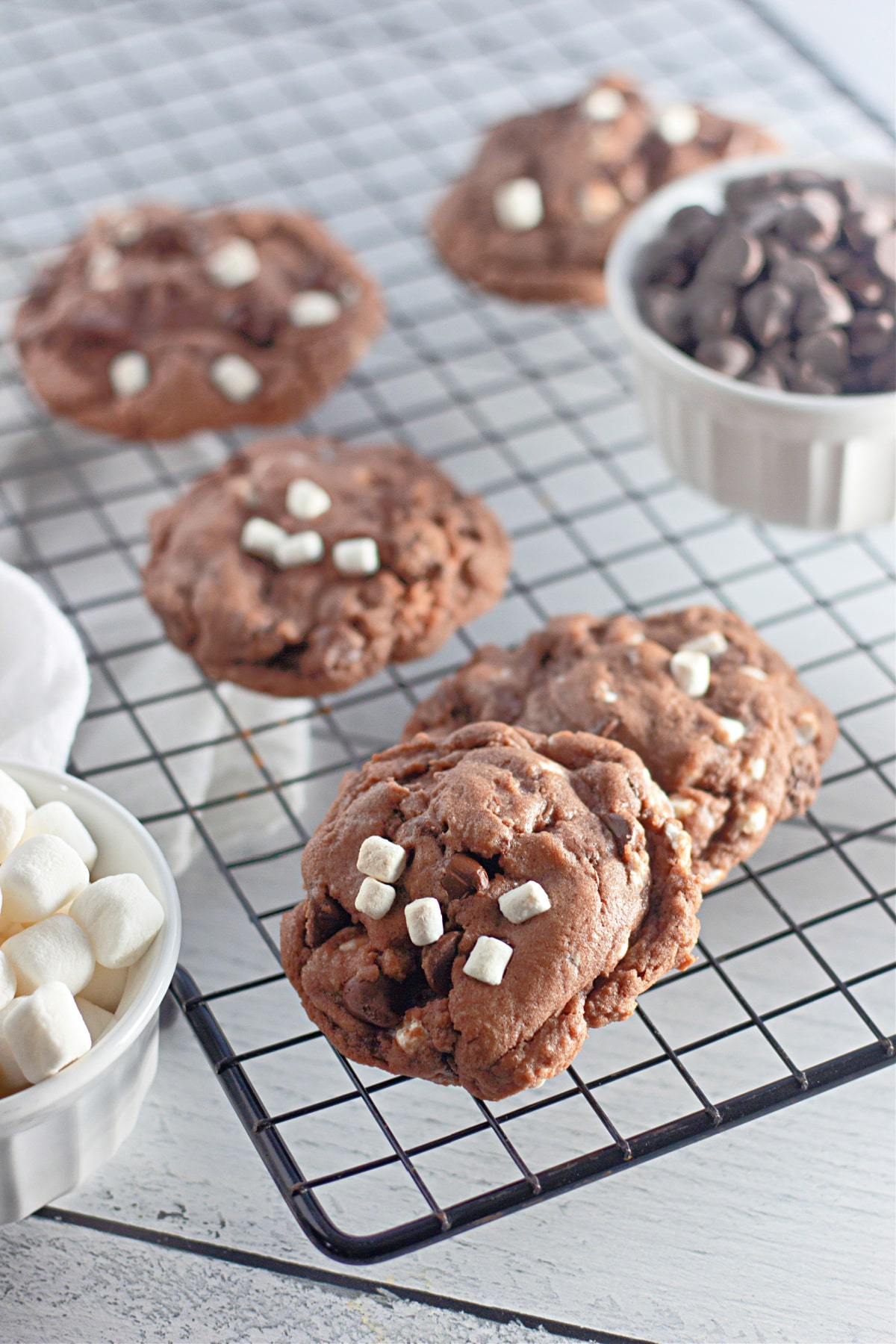 hot cocoa cookies on a wire cooling rack.