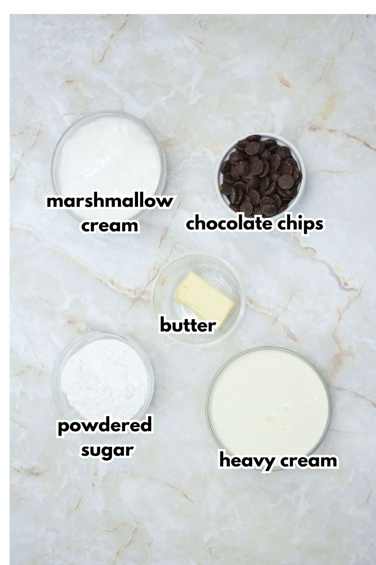 bowls of marshmallow cream, chocolate chips, butter, powdered sugar, and heavy cream.
