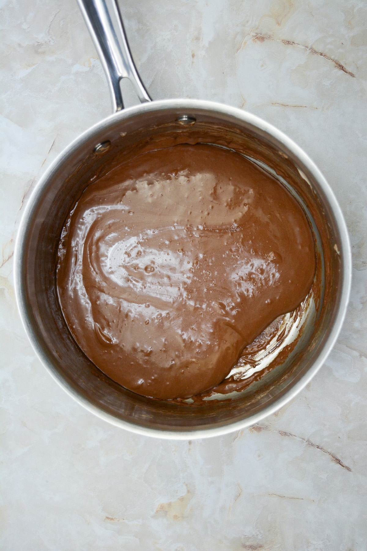 chocolate filling being made in a saucepan.