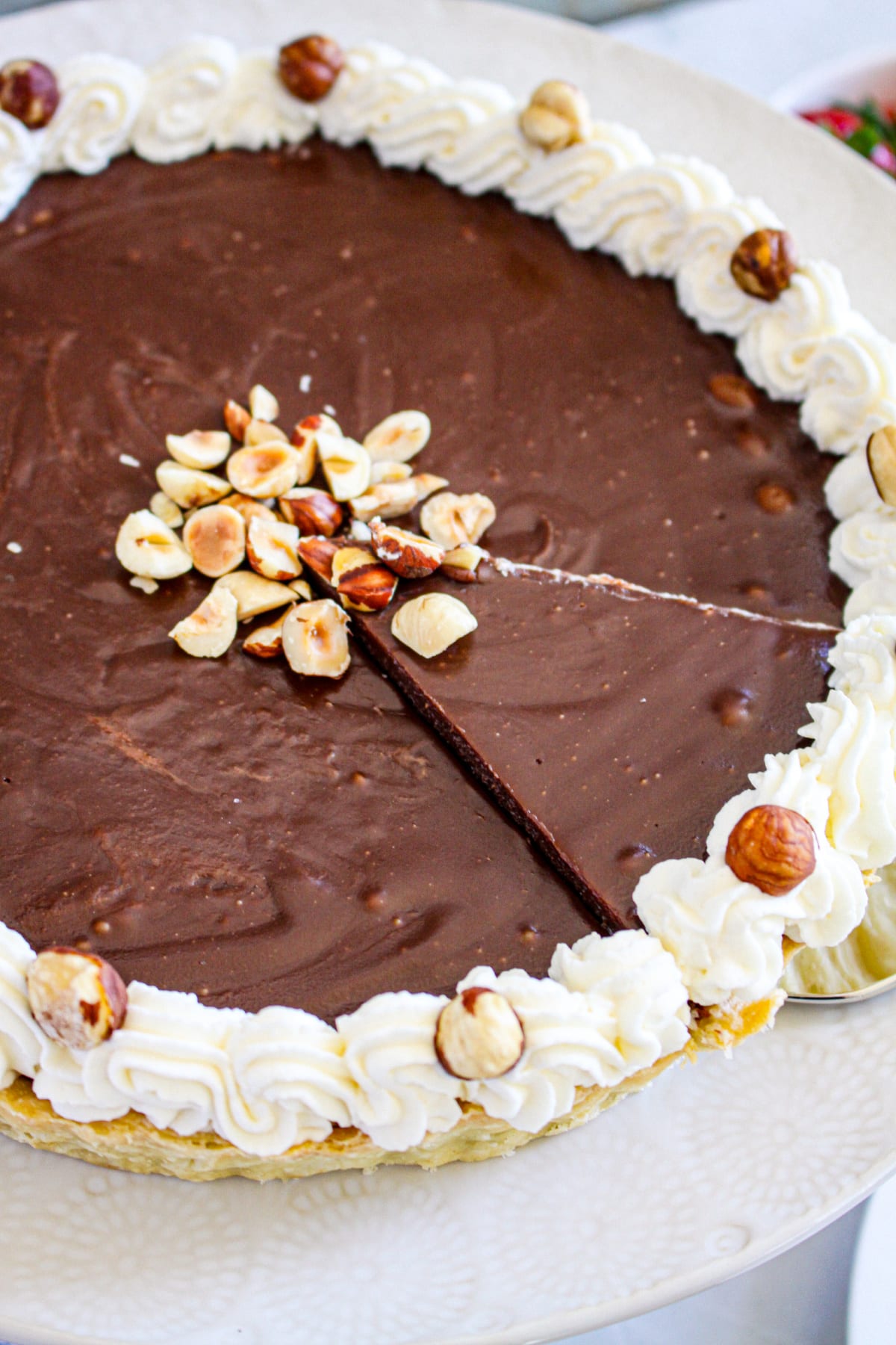 slice of nutella tart being removed from the pie.