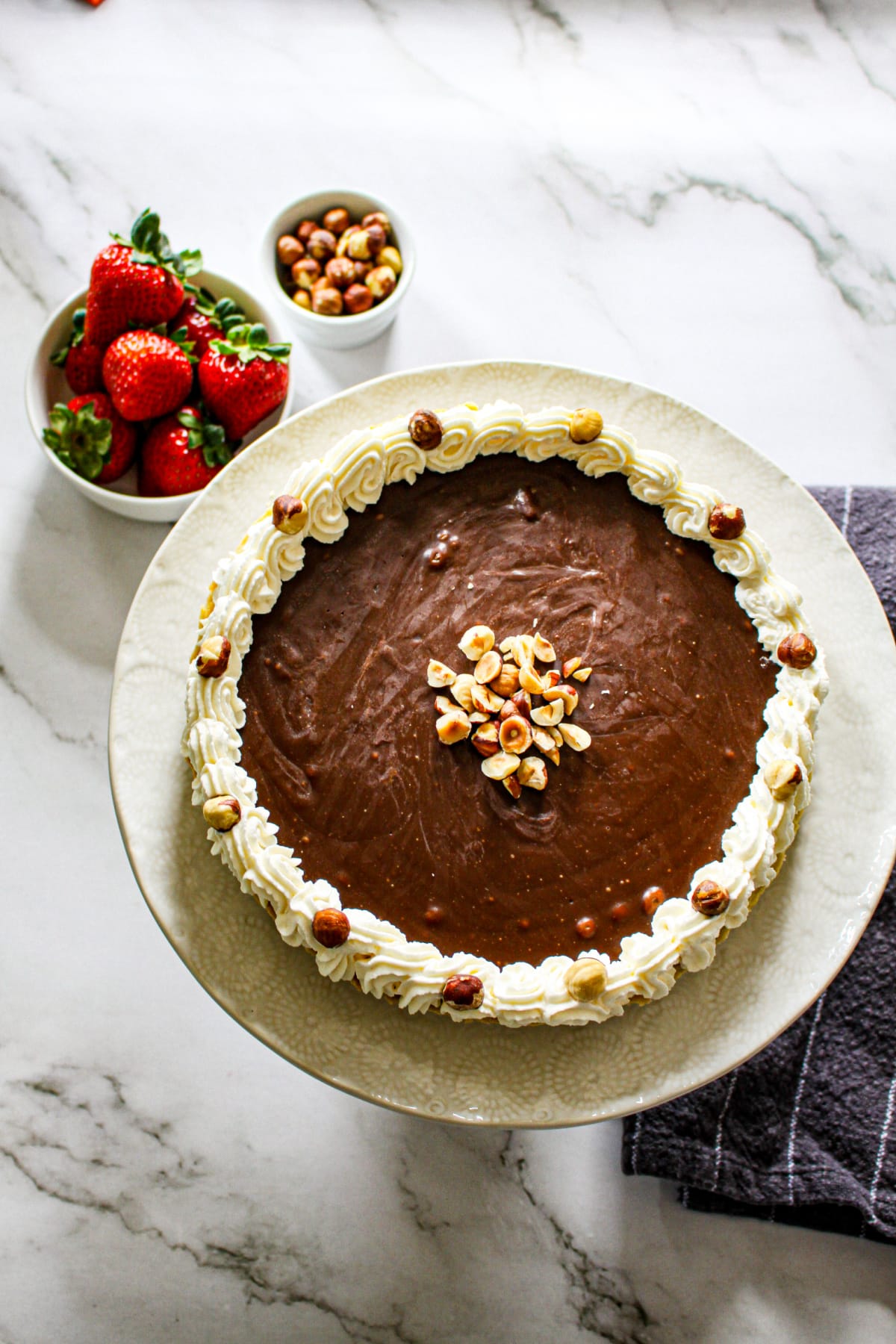 uncut nutella tart on a plate.