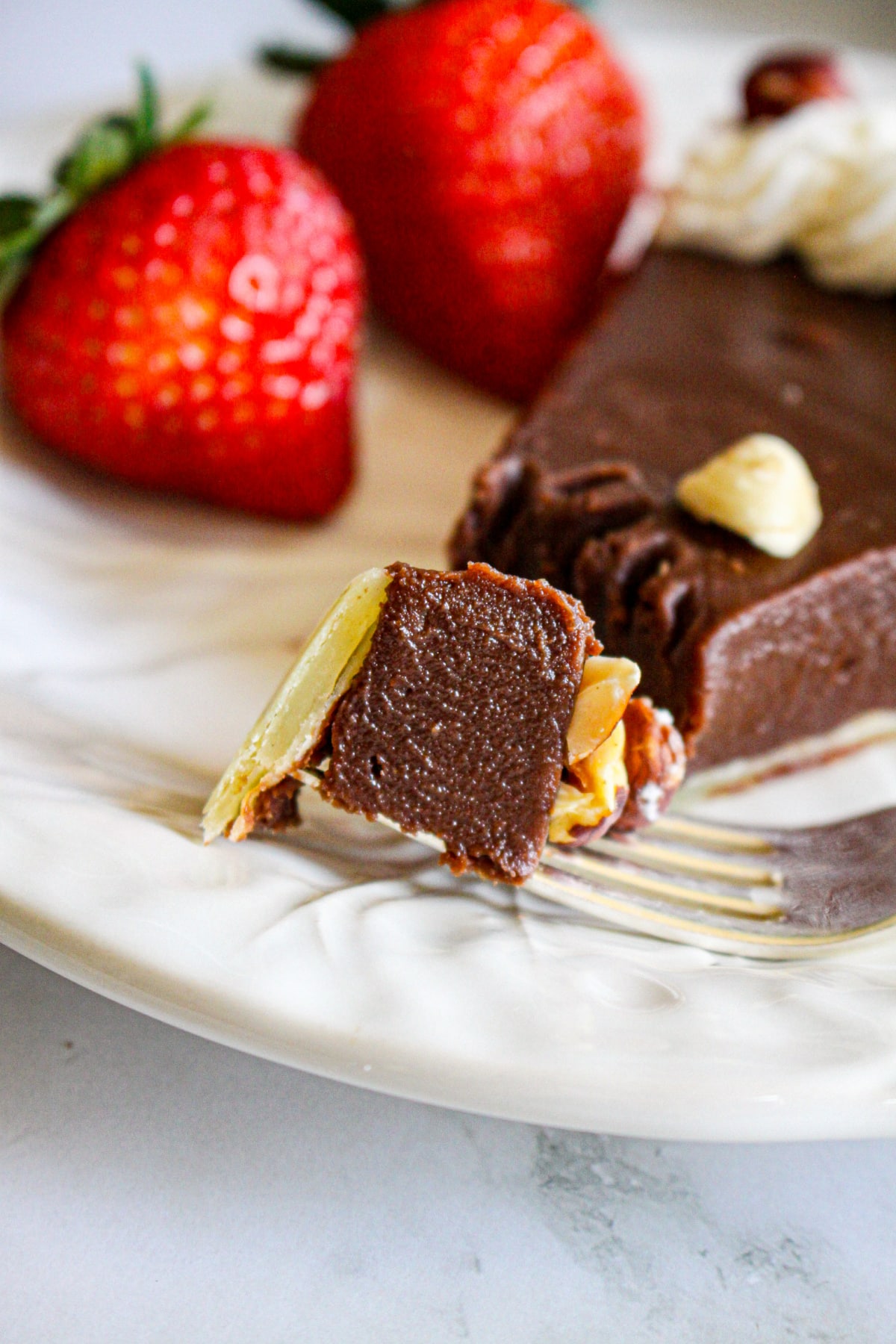 bite of nutella tart on a plate.