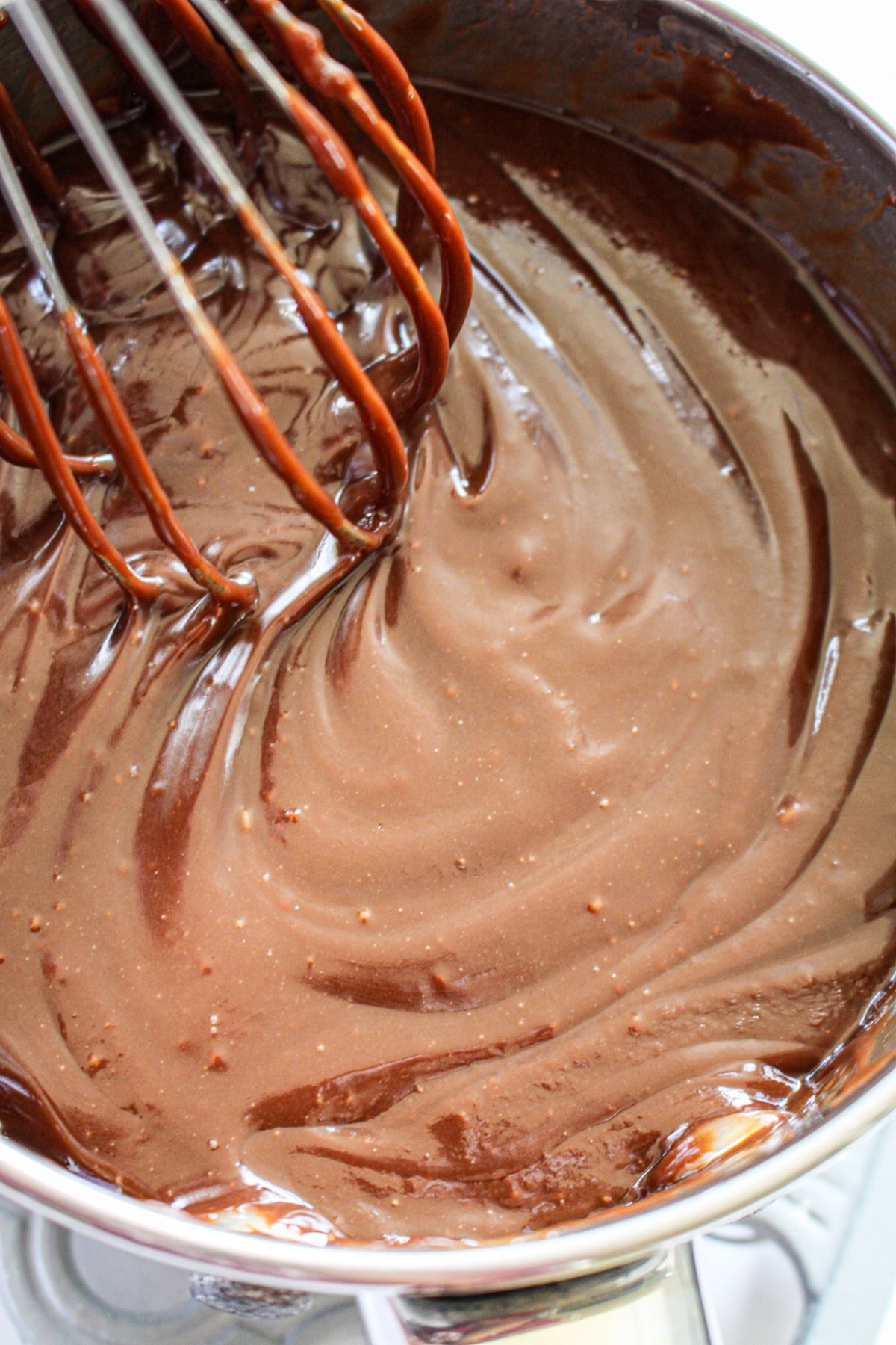 nutella filling being mixed in a stand mixer.