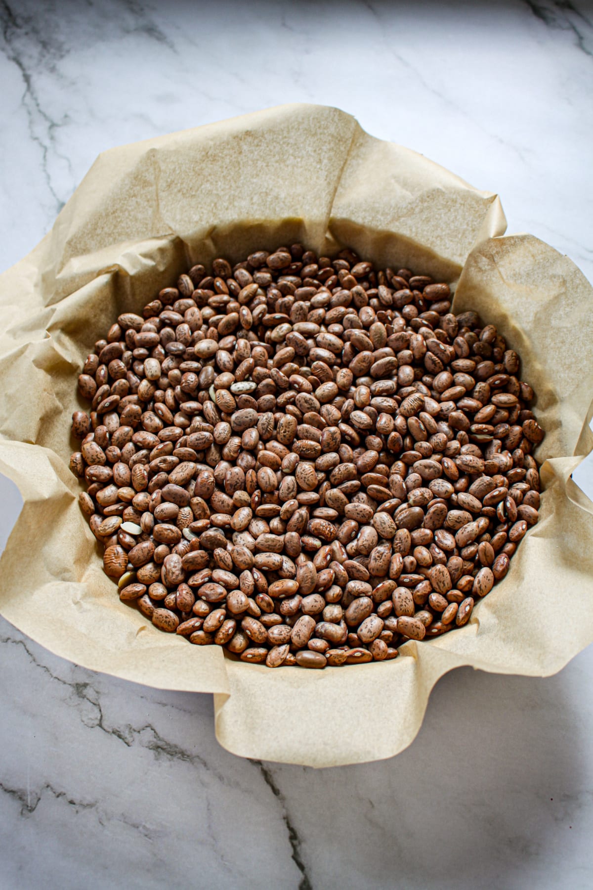 beans on top of a pie crust ready for the oven.