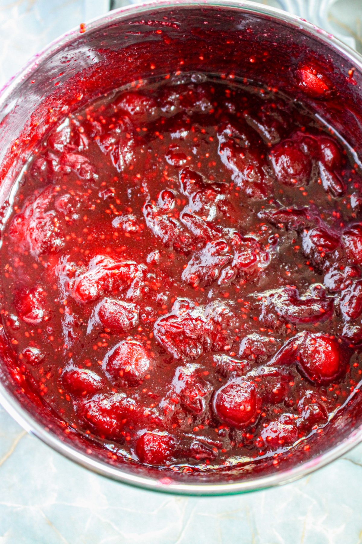 cranberry filling being cooked in a saucepan.